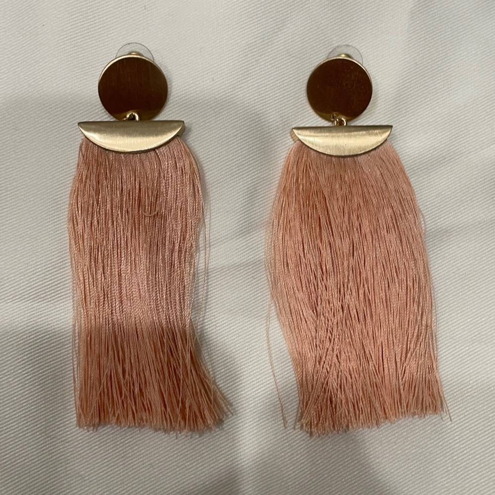 Gold statement earrings w/ peach accent.